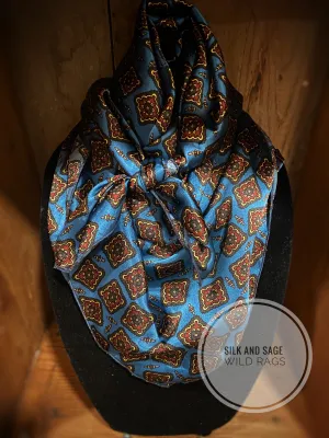 Striking blue, burgundy, tan and black silky charmeuse  print.
