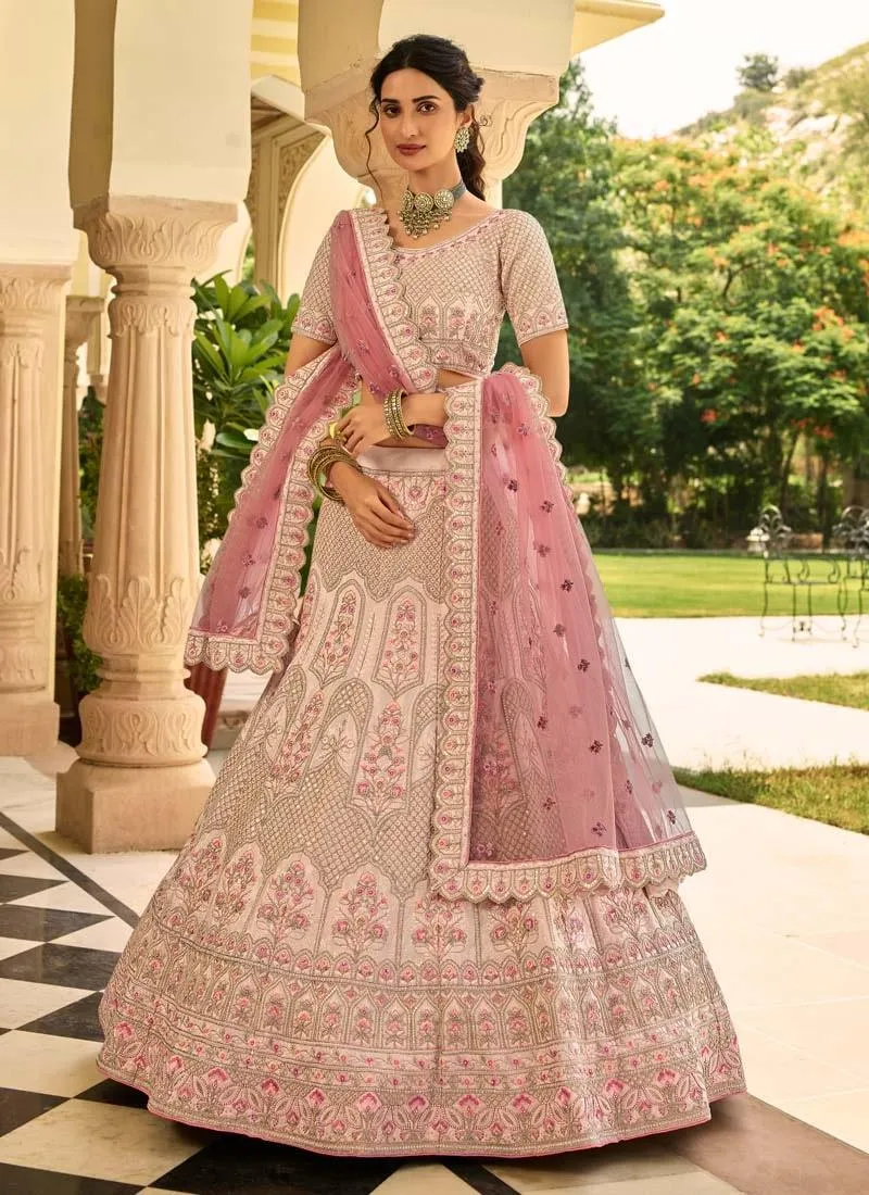 Sumptuous Stone And Zari Work Peach Color Crepe Fabric Lehenga Choli